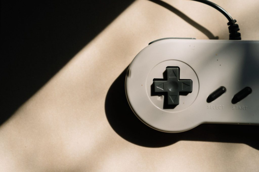 How do audio games improve accessibility for visually impaired players?